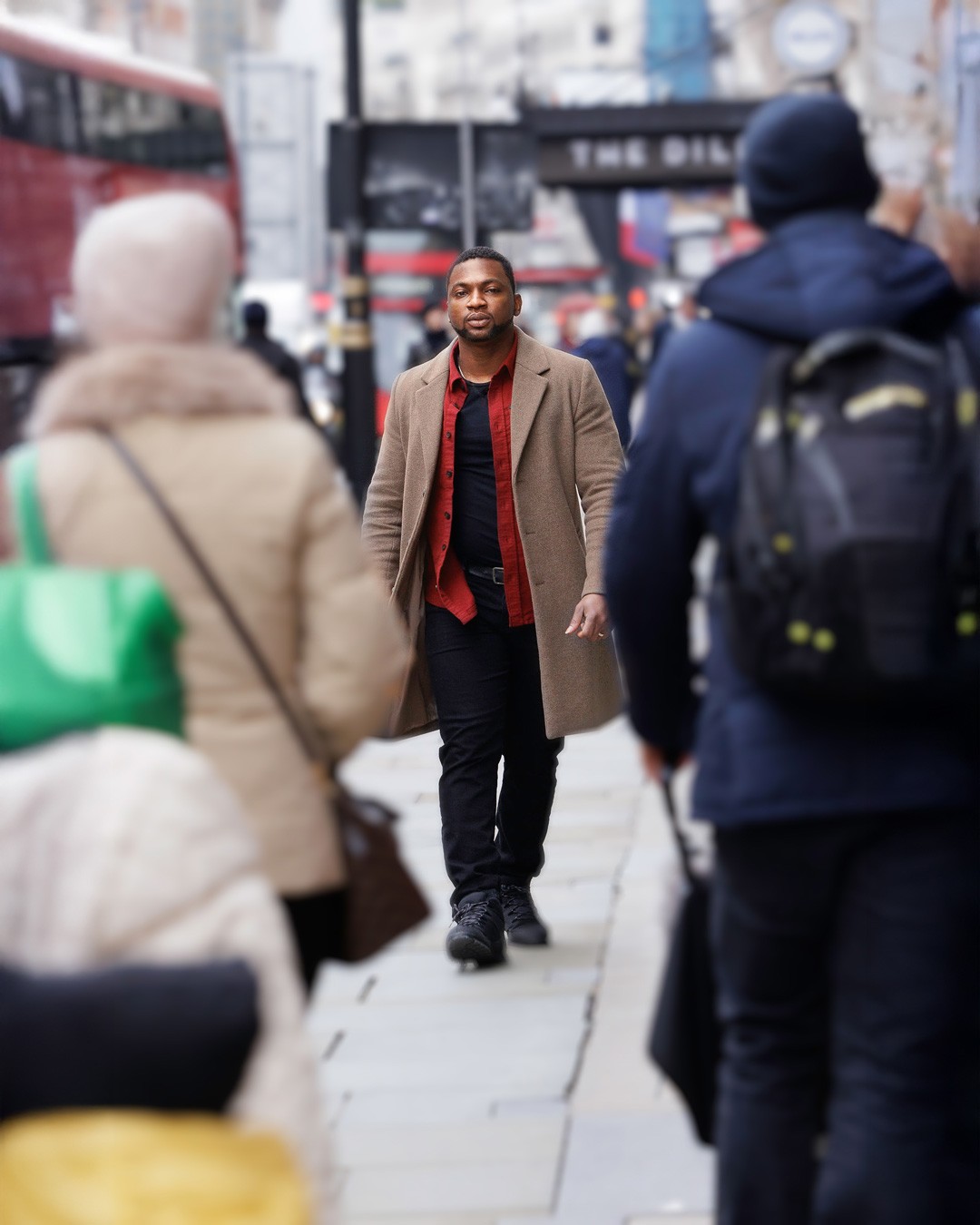 Image of Emmanuel walking on the streets of London